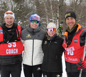 Coaches Mike Choiniere and Tom Monahan Smith with senior athletes Amanda Kauzter and Sarah Goble